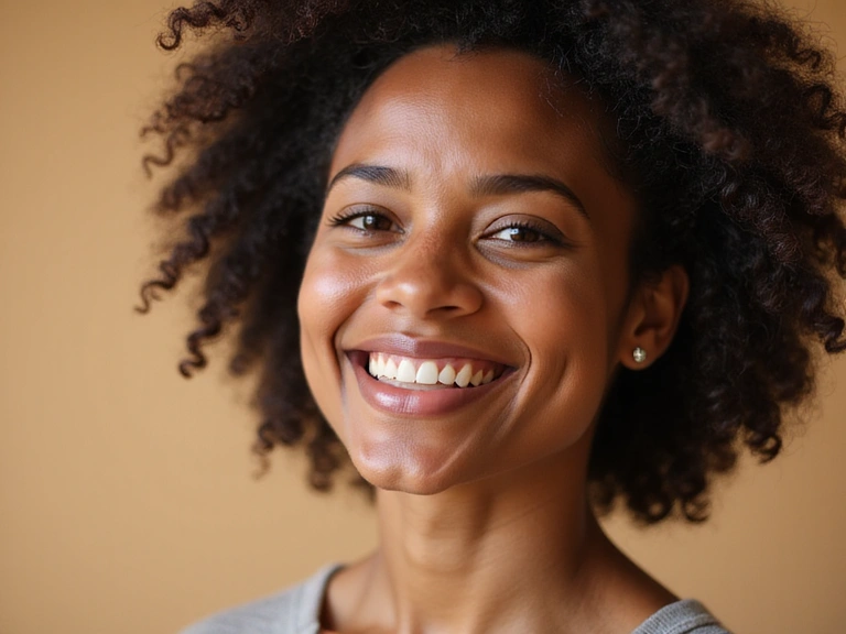 A person smiling confidently, representing customer satisfaction and well-being